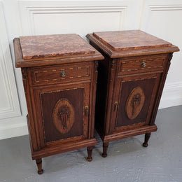 Pair of French Art Deco Oak and rouge inset marble top bedside cabinets. They have one drawer and one cupboard with elegant carving on the door. They have been sourced from France and are in good original detailed condition.