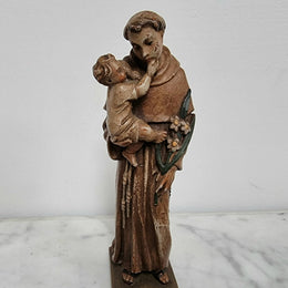 Vintage wood carved St. Anthony and baby Jesus statuette. Hand painted and is in good detailed condition.