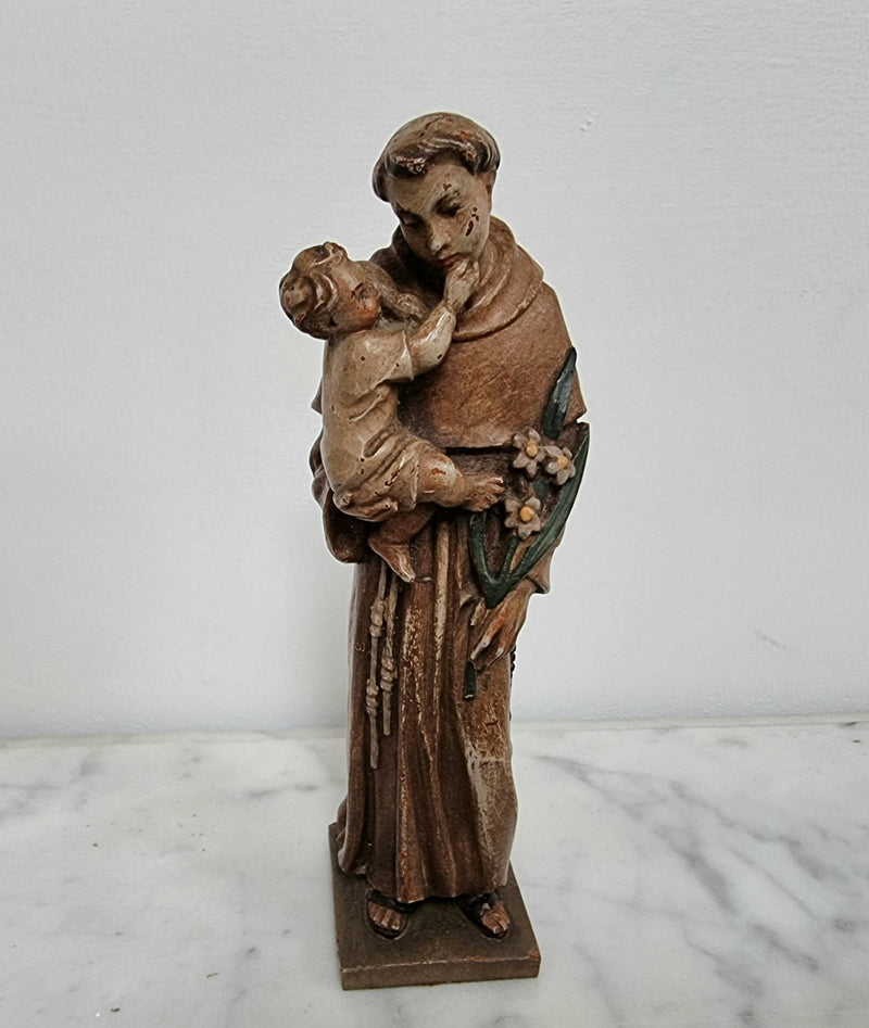 Vintage wood carved St. Anthony and baby Jesus statuette. Hand painted and is in good detailed condition.