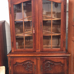 Vintage French Oak two door bookcase/display cabinet with a two door storage cabinet at the bottom. It is in good original condition.