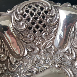 A Sheffield sterling silver bowl with repousse pattern, hallmarked WALKER & HALL and in good original condition.