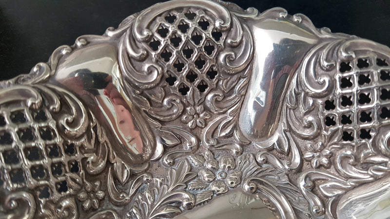 A Sheffield sterling silver bowl with repousse pattern, hallmarked WALKER & HALL and in good original condition.