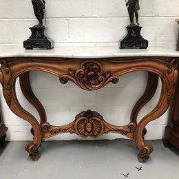 19th Century Louis XV style beautifully carved console table. With detailed ornate carving and a beautiful marble top. In good original detailed condition.