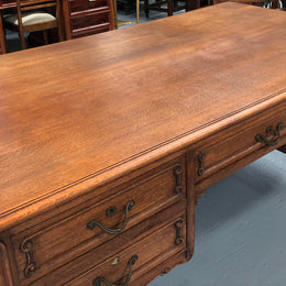 French Oak Louis XV style full partners desk with both sides having five functional drawers. In very good original detailed condition.