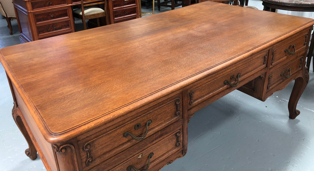 French Oak Louis XV style full partners desk with both sides having five functional drawers. In very good original detailed condition.