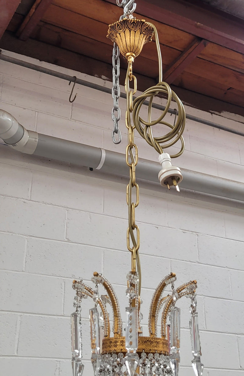 Fine French Empire basket shaped crystal chandelier. Consisting of ten exterior arms and four interior lights. It has stunning crystal's with prism drops. It has been sourced from France fully rewired to Australian standards.