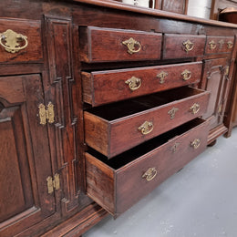 18th Century English Oak Farmhouse dresser of grand proportions. It was sourced in France and not only looks amazing but also has plenty of practical storage space. It is in good original detailed condition.