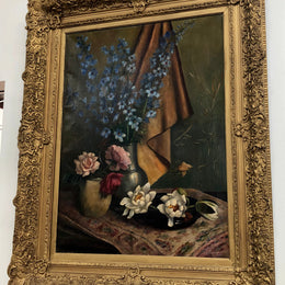 An Antique gilt-framed oil painting of floral still life. Housed in a double sweep gilt frame, signed and dated in good condition.