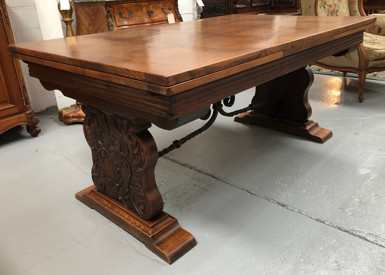 A beautiful French oak, Spanish style parquetry top extension table, with amazing carving and lovely details in very good condition.