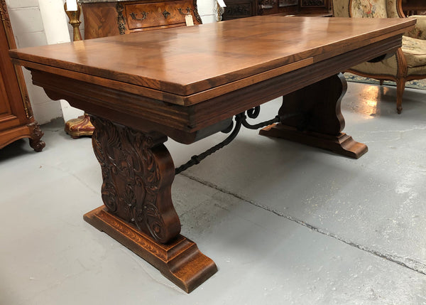 A beautiful French oak, Spanish style parquetry top extension table, with amazing carving and lovely details in very good condition.