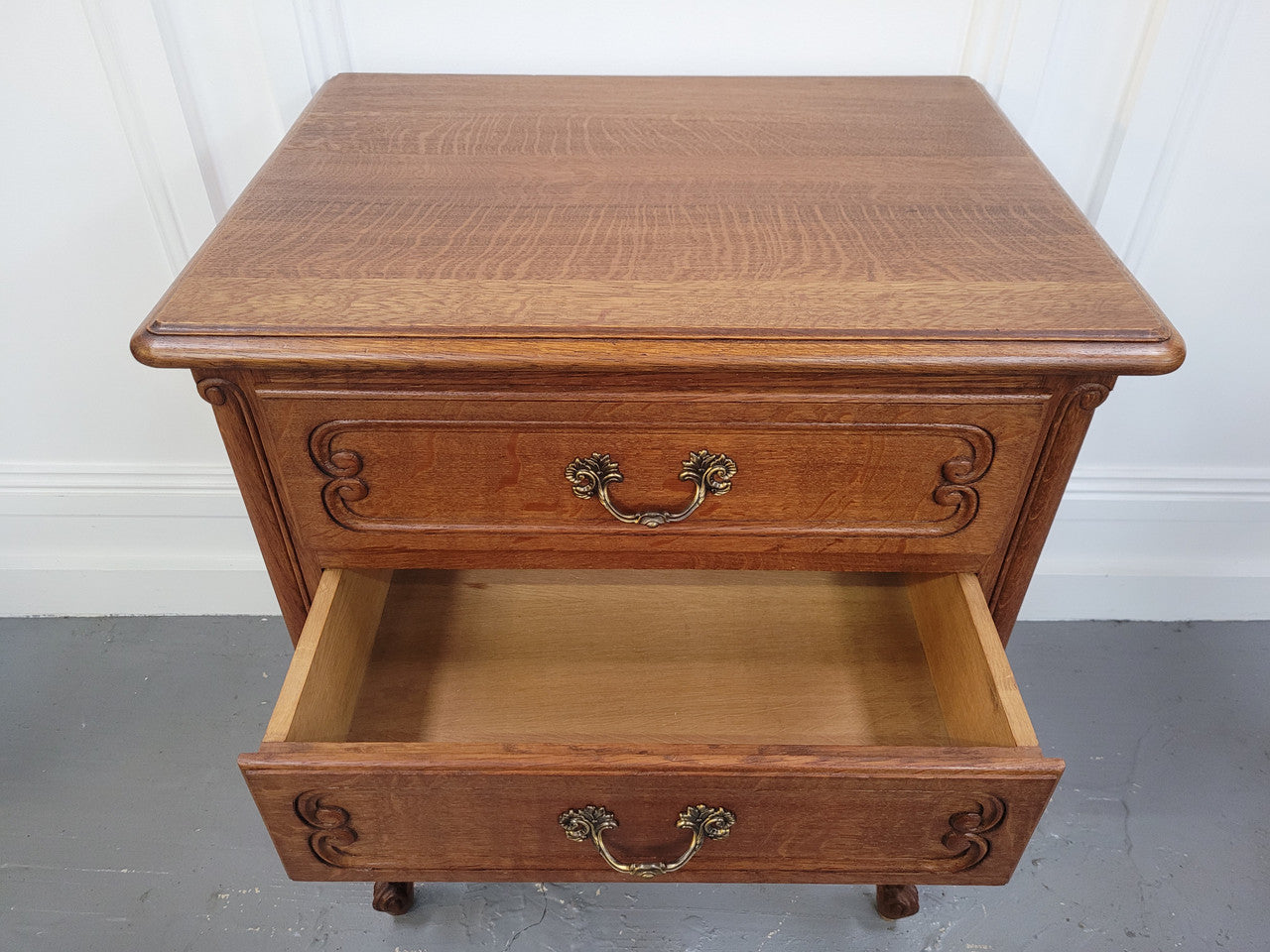 French Oak Louis XV style side drawers with lovely handles and three drawers. It has been sourced from France and is in good original detailed condition.