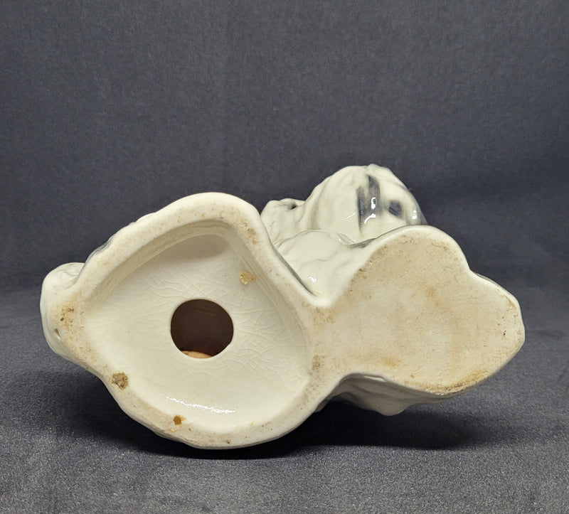 Charming vintage black and cream ceramic dog ornament. In good original condition.