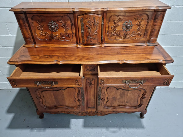 Stunning 19th Century French Walnut Buffet à Glissant from Provence, France. This is an exceptional charming piece and very functional with plenty of storage space, two large cupboards at the bottom, two drawers in the middle and two sliding doors either side at the top and finished off with a small central cupboard. In good original detailed condition. Stunning 19th Century French Walnut Buffet à Glissant from Provence, France. This is an exceptional charming piece and very functional with plenty of storag