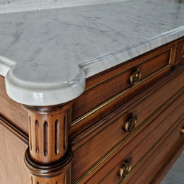 Beautiful French Louis XV Style Marble top five drawer commode. There are five drawers and it has a lovely brass inlay. It is in good original detailed condition.