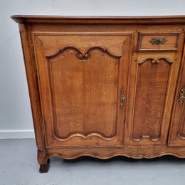 Amazing French Oak early 19th Century two door sideboard with one drawer and two fixed shelves. Sourced from France and in good original detailed condition.