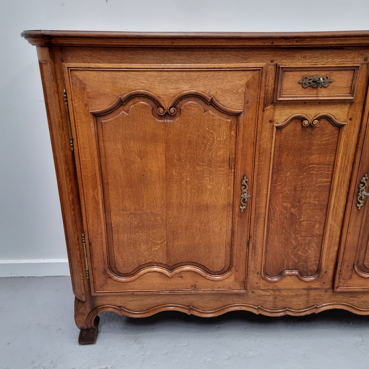 Amazing French Oak early 19th Century two door sideboard with one drawer and two fixed shelves. Sourced from France and in good original detailed condition.