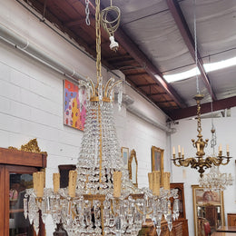 Fine French Empire basket shaped crystal chandelier. Consisting of ten exterior arms and four interior lights. It has stunning crystal's with prism drops. It has been sourced from France fully rewired to Australian standards.