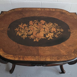 French Napoleon III style centre table. Made from Rosewood and figured Walnut and is beautifully inlaid with an ebonized edge.  It has an attractive carved undercarriage and single drawer. In good original detailed condition.