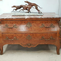 A large French Louis XV style Burr Walnut commode with a beautiful marble top. Has beautiful detailed mounts and plenty of storage space with two large drawers. From circa 1920 and in very good original condition.