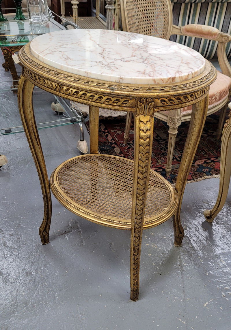 Stunning Louis XV style two tier marble topped gilt lamp/side table. It has been sourced from France and is in good original detailed condition.