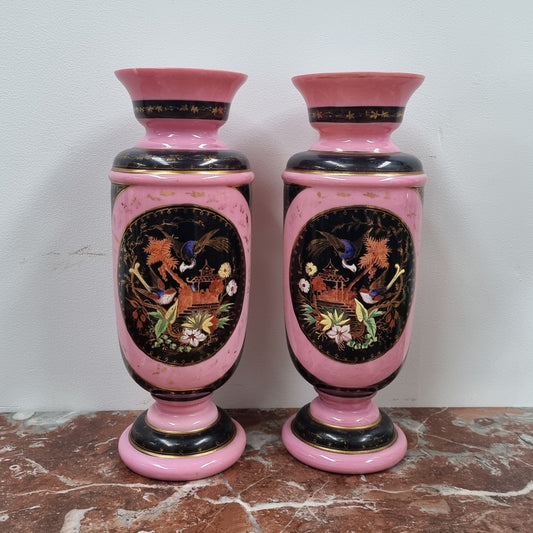 Late Victorian pink and hand painted, enameled pair of vases with some ware to enameling. It is in good original condition.