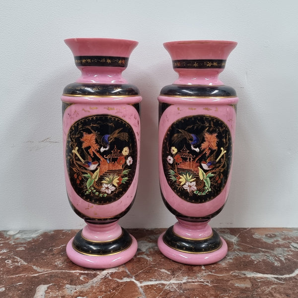 Late Victorian pink and hand painted, enameled pair of vases with some ware to enameling. It is in good original condition.