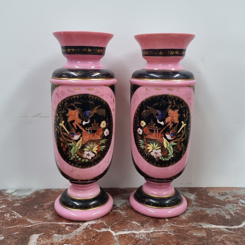 Late Victorian pink and hand painted, enameled pair of vases with some ware to enameling. It is in good original condition.