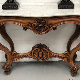 19th Century Louis XV style beautifully carved console table. With detailed ornate carving and a beautiful marble top. In good original detailed condition.