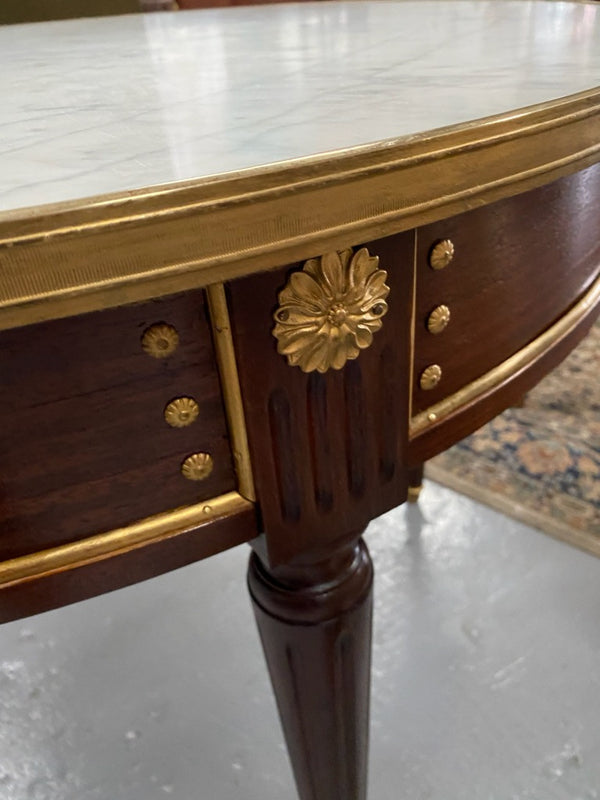 Stunning Antique French Louis XVI Style Mahogany & marble top round table. It has beautiful ormolu mounts and is in restored condition. Could be used as a dining table or as a center table.