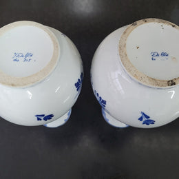 Pair of Victorian delft blue hand painted vases. Stamped underneath and one featuring a ship scene and the other a windmill scene. Please note the windmill vase does have a hairline crack at the top otherwise in good condition, please view photos as they help form part of the description.