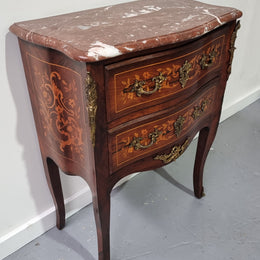 A stunning French petite two drawer inlaid Rosewood commode. In good original detailed condition.