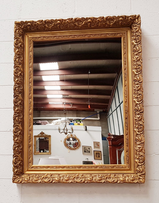 Large French Antique 19th century ornate gilt framed mirror. Circa 1880 and it is in very good original condition.