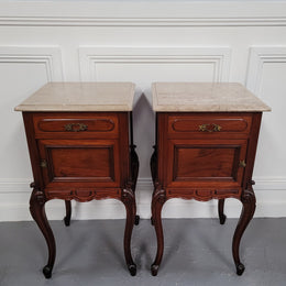Pair of French Antiloopque Louis XV style Walnut and marble top bedsides. They have lovely carvings along with a drawer and cupboard space. They are in good original detailed condition and have been sourced from France