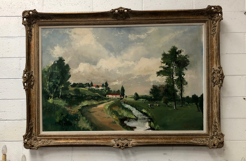Lovely framed French signed oil on canvas of a country scene in a ornate decorative frame and is in good original condition.