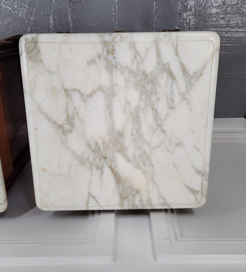 Pair of French Antique Louis XV style Oak marble top night stands. They have beautiful carved cabriole legs and beautiful white marble along with a drawer and cupboard for storage space. They have been sourced from France and are in good original detailed condition.