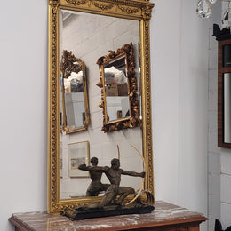 Impressive French Napoleon III water gilded mantle mirror. It is beautifully decorated with allegorical themes and has been sourced from France. In good original detailed condition with original mirror.
