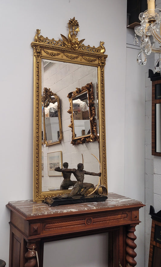 Impressive French Napoleon III water gilded mantle mirror. It is beautifully decorated with allegorical themes and has been sourced from France. In good original detailed condition with original mirror.