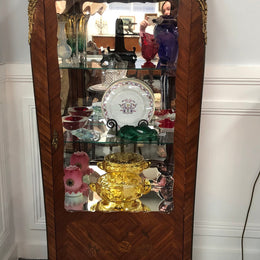A Louis XV style Kingwood vitrine with marble top. It has beautifully floral inlay with ormolu mounts.