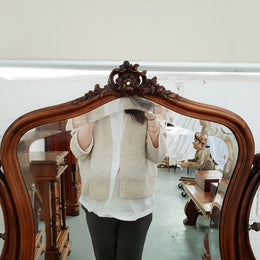 French walnut Antique Louis XV style dressing table of petite size, retaining it's original bevelled edge tilt mirror. In good original condition with three small drawers. Circa 1900.