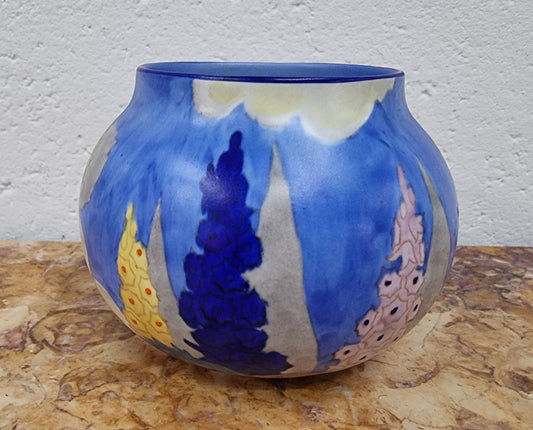 Carlton Ware vase globular shape with hand painted potted rose bush and hollyhocks in a blue/cream matt glaze.