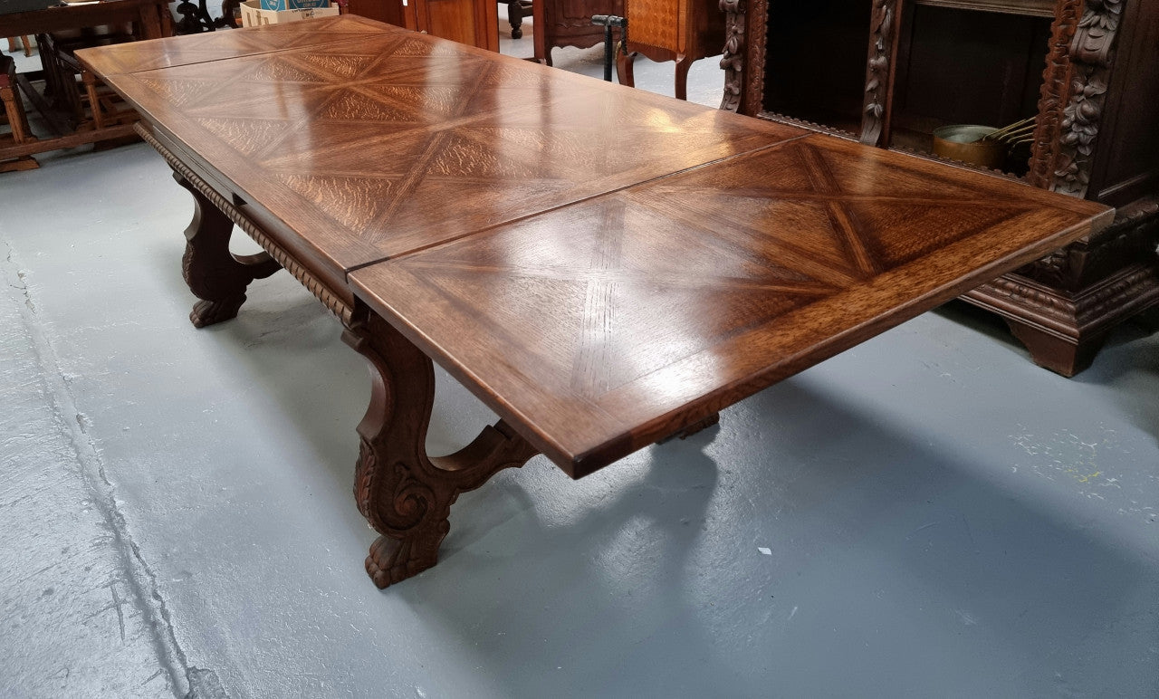 French SFrench Spanish style Oak parquetry top extension table. In good original detailed condition.panish style Oak parquetry top extension table. In good original detailed condition.