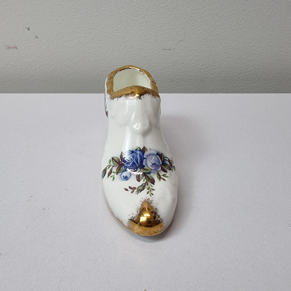 A lovely pair of Royal Albert China shoes in good original condition. Stamped on the sole 'Moonlight Rose: Royal Albert Bone China, England ©1987.