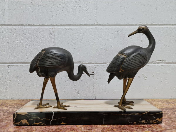 Fabulous French Art Deco cold painted spelter Ibis birds on a stylized Art Deco marble base. Signed "Rochard" circa 1930's. In good original detailed condition.
