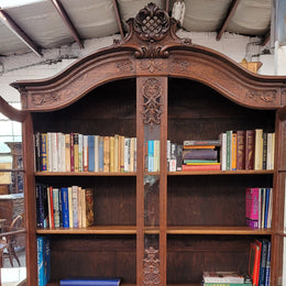 Substantial French Oak Louis 15th Style large two door bookcase. Adjustable shelves and very decorative carving. In good original detailed condition.