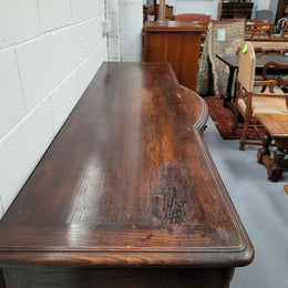 French dark oak three door and three drawer sideboard. Plenty of storage space and it is in good original detailed condition.