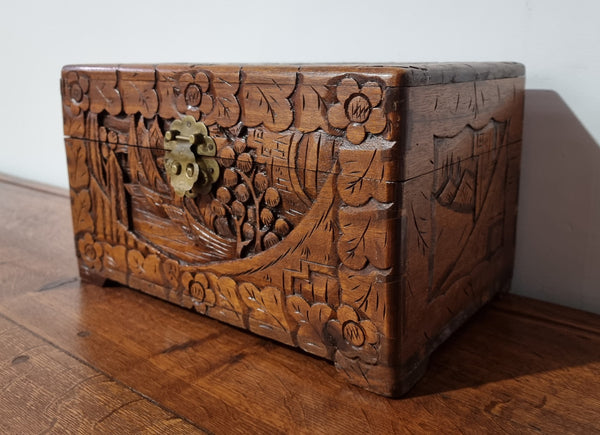 Small Chinese carved camphor wood jewellery box. It is in original condition.