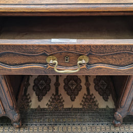 Fabulous Louis XV style French Oak beautifully carved full partners desk. Both sides have a functioning drawer in the middle and two cupboards either side. On both sides one cupboard door opens up to four smaller internal drawers. Plenty of storage space and a large top surface to work on. It is in good original detailed condition.