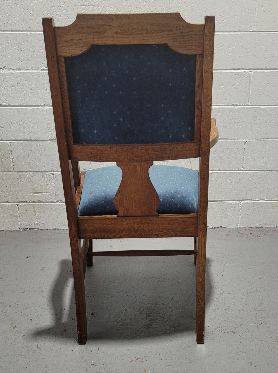 Arts and crafts style blue upholstered armchair. In good original detailed condition.