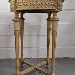 Louis XVI style round side table with original paint and a beautiful thick marble top. It is in good original detailed condition.