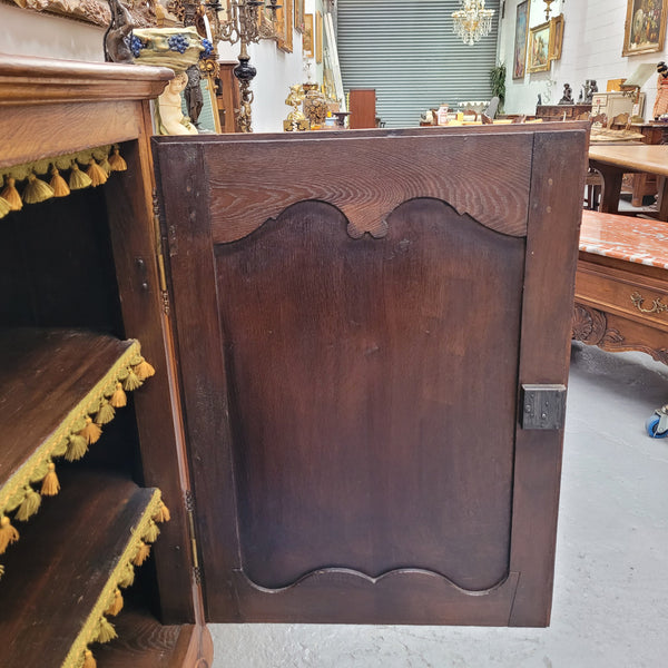 Amazing French Oak early 19th Century two door sideboard with one drawer and two fixed shelves. Sourced from France and in good original detailed condition.